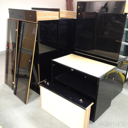 Roche Bobois Parcel-gilt and Black-painted Three-section Cabinet. Estimate $20-200