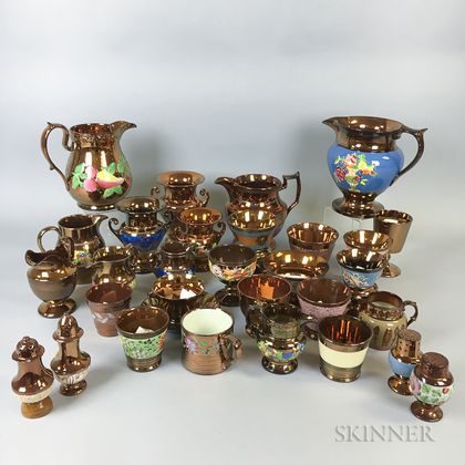 Thirty Pieces of Copper Lustre Ceramic Tableware. Estimate $20-200