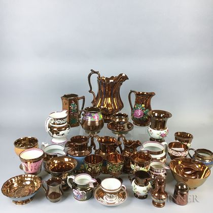 Thirty-two Pieces of Copper Lustre Ceramic Tableware. Estimate $20-200