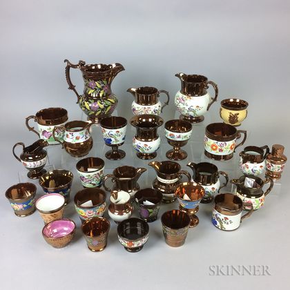 Thirty Pieces of Copper Lustre Ceramic Tableware. Estimate $20-200
