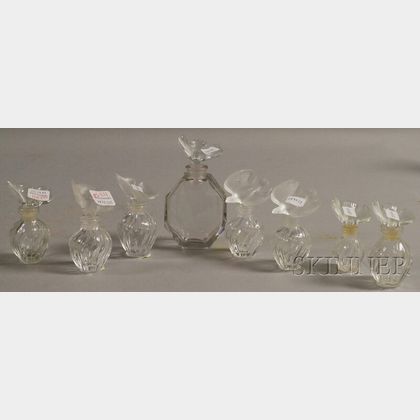 Seven Lalique Nina Ricci Perfume Glass Bottles and a Baccarat Nina Ricci Perfume Glass Bottle. 