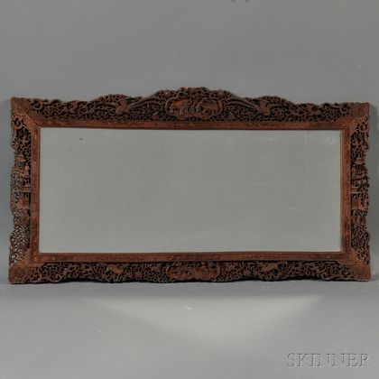 Mirror with an Ornate Wood Frame