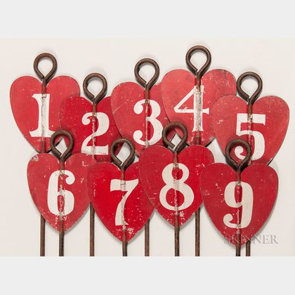 Set of Nine Red-painted Tin and Iron Heart-shaped Golf Hole Markers
