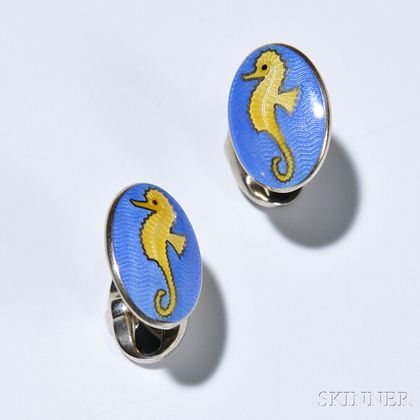 Pair of Oval Seahorse Cuff Links, Deakin & Francis, sterling silver with yellow enamel seahorses on a blue ground, signed. 