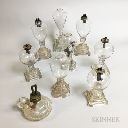 Nine Colorless Glass Oil Lamps