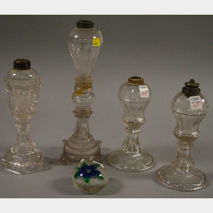 Four Colorless Glass Fluid Lamps and a Blue Flower Paperweight