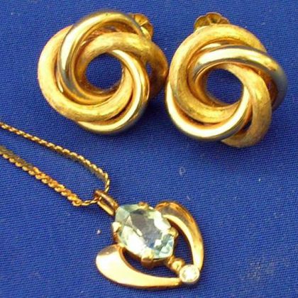 Gold Knot Earrings and Aquamarine Pendant. 