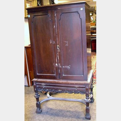 Irving & Casson/A.H. Davenport Baroque-style Carved Mahogany Two-Door Sheet Music Cabinet. 