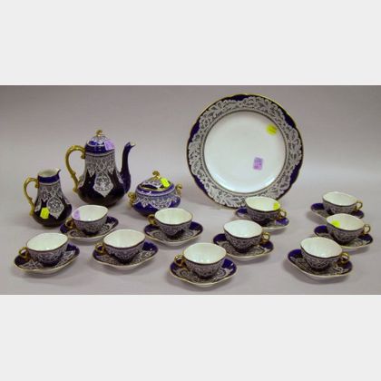 Twenty-four Piece Bottacin Lace and Cobalt Decorated Porcelain Demitasse Set. 