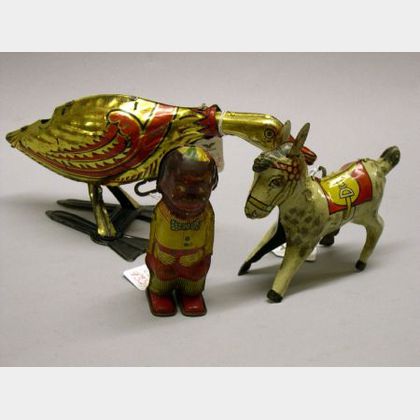Four Mechanical Lithographed Tin Toys