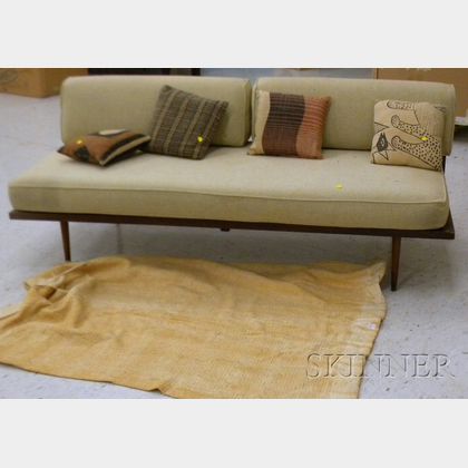 Mid-century Modern Wooden Sofa with Cushions and a Rug. 