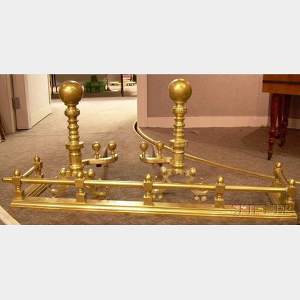 Pair of Brass Ball-top and Ring Turned Andirons and a Brass Fireplace Fender. 
