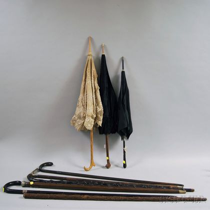 Ten Mostly Carved Canes and Parasols