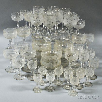 Approximately Sixty Pieces of Etched Grapevine-pattern Crystal Stemware and Finger Bowls. Estimate $250-350