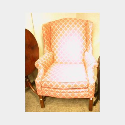 Chippendale-style Upholstered Mahogany Wing Chair. 