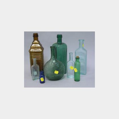 Collection of Twenty-three Colored and Colorless Glass Bottles, including Browns Bitters Indian, 1859 Emerald Pine Tree Tar Cordial, 