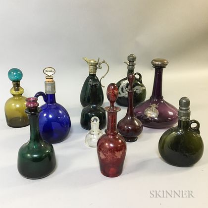 Eleven Mostly Colored Glass Decanters