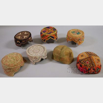 Seven Woven and Decorated Central Asian Caps. 