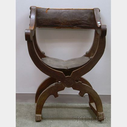 Italian Carved Walnut Savonarola Chair with Leather Upholstered Back and Seat. 