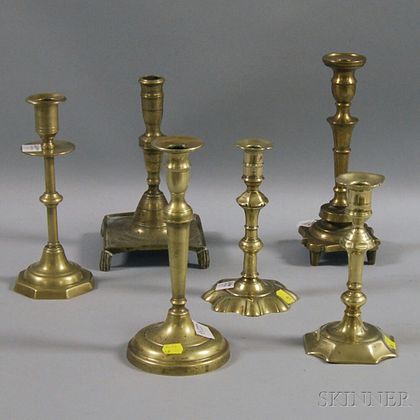 Six Early Brass Candlesticks