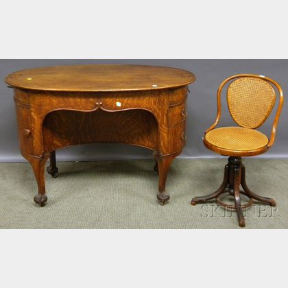 Early 20th Century Oval Carved Oak Flat-top Writing Desk and Bentwood Caned Adjustable Swivel Chair