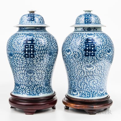 Near Pair of Blue and White Jars and Covers