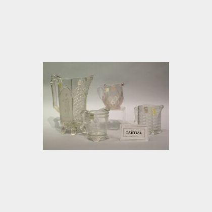 Twenty-eight Frosted Colorless Glass Pattern Creamers and a Pitcher and Lid. 
