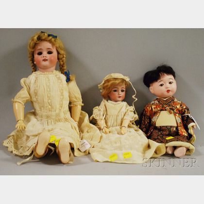 Two German Bisque Head Dolls and a Composition Japanese Baby