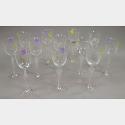 Set of Twelve Igor Carl Faberge Designed Colorless Molded Figural Glass Wine Stems. 