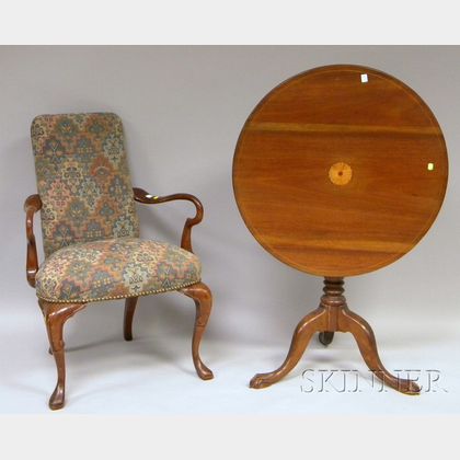 Chippendale-style Inlaid Mahogany Tilt-top Tea Table and a Queen Anne Style Upholstered Carved Walnut Armchair. Estimate $75-100