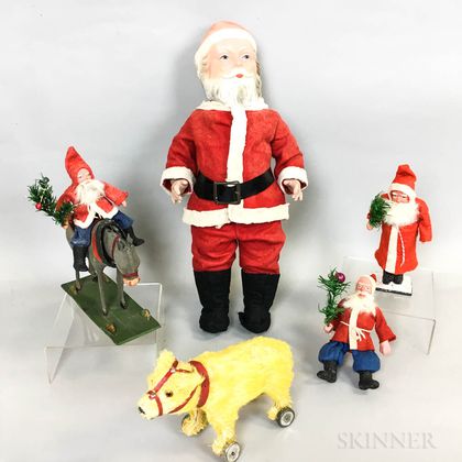 Four Papier-mache and Composition Santa Clauses and a Bear Pull Toy