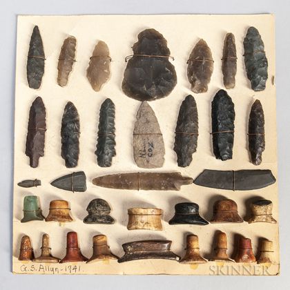 Cardboard Mount with Thirty-four Eskimo Artifacts