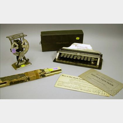 Bennett Portable Typewriter, a Metal Postal Scale, and a Keuffel & Esser Slide Rule. 