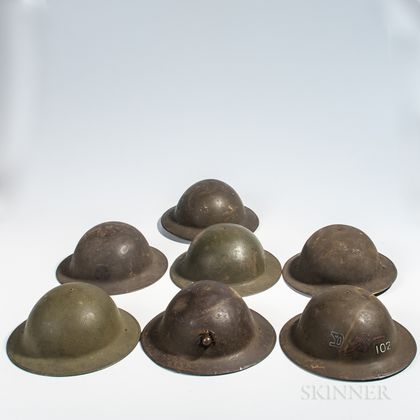 Seven WWI-era Helmets and Shells