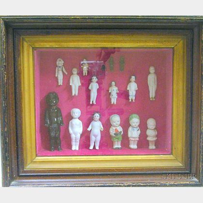 Fifteen Small China Dolls in a Walnut Shadow Box