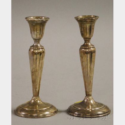 Sold at auction Pair of Cartier Sterling Weighted Candlesticks