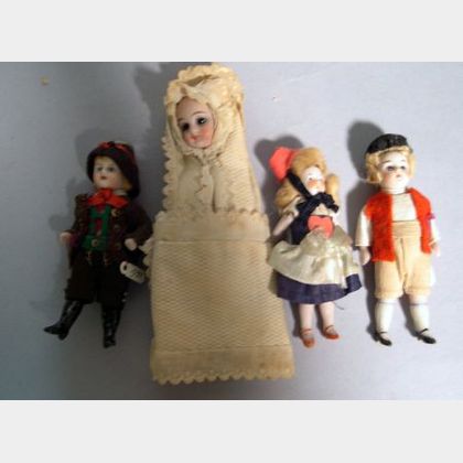Three Small All-Bisque Dolls and a Baby in Swaddling Clothes