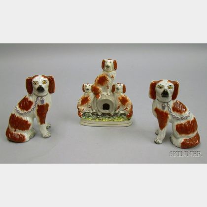 Pair of Staffordshire Spaniels and a Spaniel Figural Group