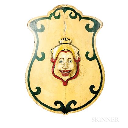 Carved and Painted Wood Shield-form Carnival Sign with a Mask of a Clown