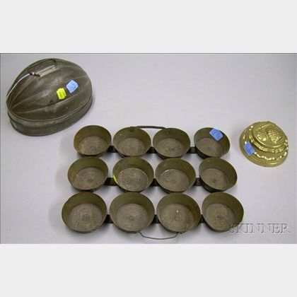 Tin Melon-form Mold, a Metal Twelve-Muffin Baking Tray, and a Brass Food Mold. 