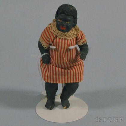 Small Black Painted Composition Doll