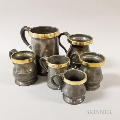 Six Brass-rimmed Pewter Measures