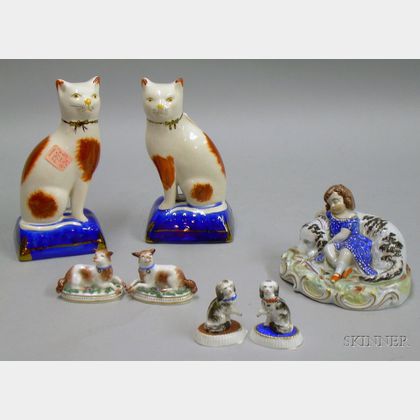 Pair of Staffordshire Seated Cats, a Sleeping Girl with Dog Figural Group, and Two Pairs of Porcelain Dogs.... 