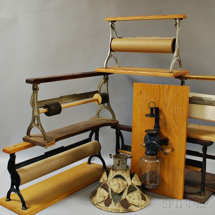 Eight Wood and Iron Paper Holders, a Coffee Grinder, and a Christmas Tree Stand. Estimate $250-350