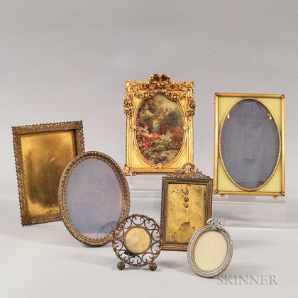 Seven Small Pressed Metal and Wood Picture Frames