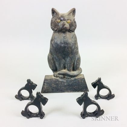 Set of Four Celluloid Scottie Napkin Rings and a Cast Iron Cat Doorstop