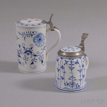 Two Blue and White Ceramic Steins