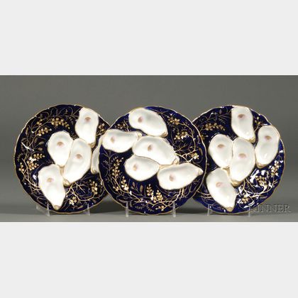 Set of Three Gilt and Cobalt Decorated Porcelain Oyster Plates. 
