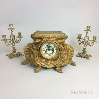 Rococo-style Brass Mantel Clock and a Pair of Three-light Candelabra