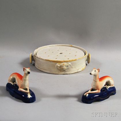 French White Faience Two-piece Plate Warmer and a Pair of Staffordshire Greyhound Whippet Figures